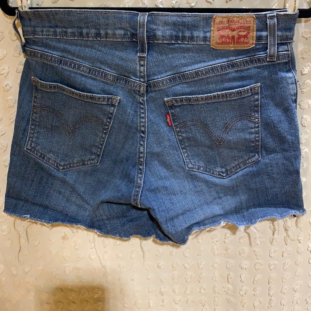 Levi’s jean shorts cut offs, size 28 stretch material blue mid to high rise